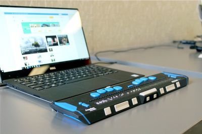 Open laptop with braille keyboard attached